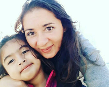 Victoria, a young girl with LC-FAOD poses with her mother, Myriam